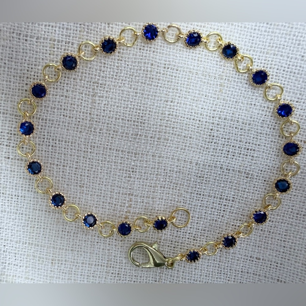 Stunning 18K real gold plated bracelet w sparkling round blue CZ stones.7.5”GIFT